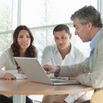 Man Explaining an Investment Plan To Couple