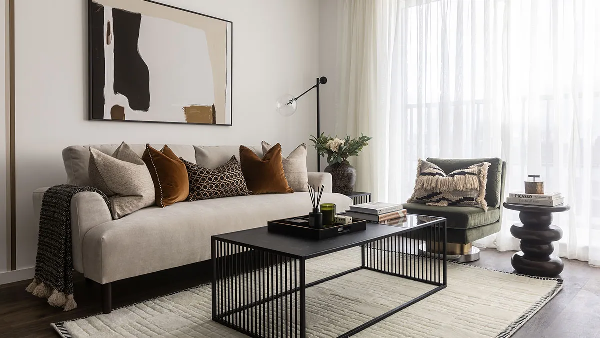 Stylish sofa and textured wallpaper