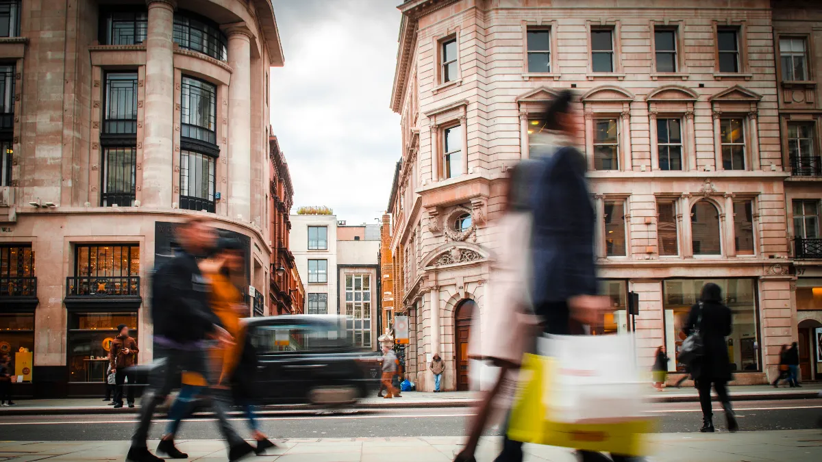 Shoppers carrying shopping bags in London