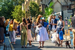 People wearing masks in summer London